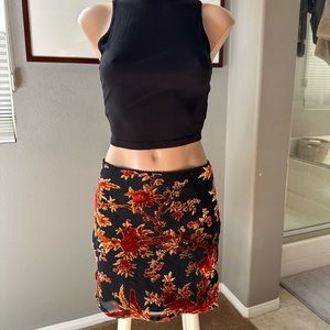 Velvet floral mini skirt. Size 8. New condition.